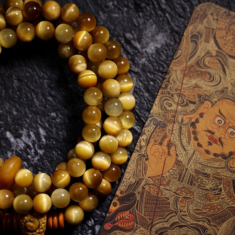 Kailashforce Artisanal Tibetan Gold Tiger’s Eye 108 Bead Mala Bracelet Sandalwood Backcloud, Brass Nine Palaces Amber Tassel Sacred Jewelry for Men Women